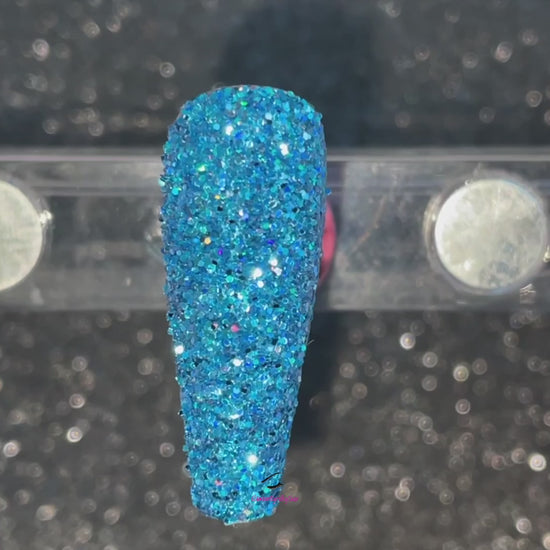 This glitter is part of the simple glitter collection. It consists of Caribbean sea blue glitter with a holographic sparkle.  Poolside can be used for your face, hair, body, nail art and glitter slime. Available in 5g jars only.