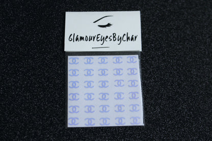 No need to go to the nail salon. Spice up your nails at home with these unique Chanel designer inspired nail decals. They can be used on natural or acrylic nails. You can also easily apply them on top of regular or gel/shellac nail polish. These handmade decals can also be used for body art or any DIY project. Each pack contains 30 decals and is available in 4 different colours.