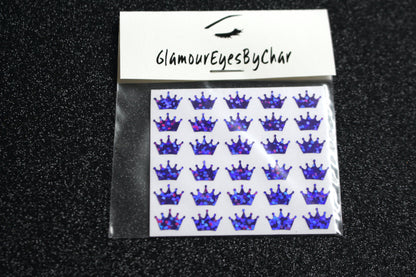 No need to go to the nail salon. Spice up your nails at home with these cute crown nail decals. They can be used on natural or acrylic nails. You can also apply them on top of regular or gel/shellac nail polish. These handmade decals can also be used for body art or any DIY project. Each pack contains 30 decals and is available in 6 different colours.  Tip: Apply some of our glitter on your nails to really GLAMOUREYES your look.  