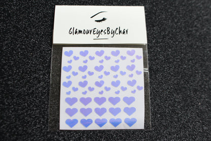 No need to go to the nail salon. Spice up your nails at home with these cute heart nail decals. They can be used on natural or acrylic nails. You can also apply them on top of regular or gel/shellac nail polish. These handmade decals can also be used for body art or any DIY project. Each pack contains 60 decals and is available in 4 different colours.  The pack also includes 4 different sizes so that you can mix and match.  Tip: Apply some of our glitter on your nails to really GLAMOUREYES your look.