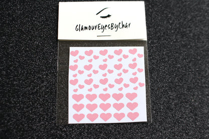 No need to go to the nail salon. Spice up your nails at home with these cute heart nail decals. They can be used on natural or acrylic nails. You can also apply them on top of regular or gel/shellac nail polish. These handmade decals can also be used for body art or any DIY project. Each pack contains 60 decals and is available in 4 different colours.  The pack also includes 4 different sizes so that you can mix and match.  Tip: Apply some of our glitter on your nails to really GLAMOUREYES your look.