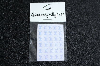 Spice up your nails with these unique LV designer inspired nail decals. They can be used on natural or acrylic nails. You can also apply them on top of regular or gel/shellac nail polish. These handmade decals can also be used for body art or any DIY project. The pack contains 30 decals and is available in 4 different colours.   Size: ﻿W= 0.21 inches, H= 0.252 inches  Tip: Apply some of our glitter on your nails to really GLAMOUREYES your look.