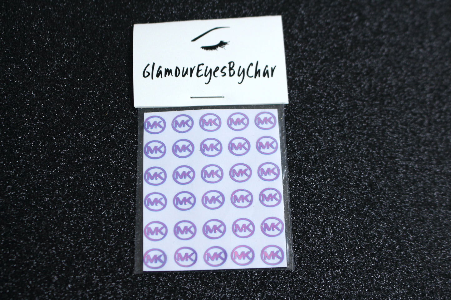 No need to go to the nail salon. Spice up your nails at home with these unique Michael Kors designer inspired nail stickers. They can be used on natural or acrylic nails. You can easily also apply them on top of regular or gel/shellac nail polish. These handmade stickers can also be used for body art or any DIY project. Each pack contains 30 stickers and is available in 5 different colours.  Tip: Apply some of our glitter on your nails to really GLAMOUREYES your look.