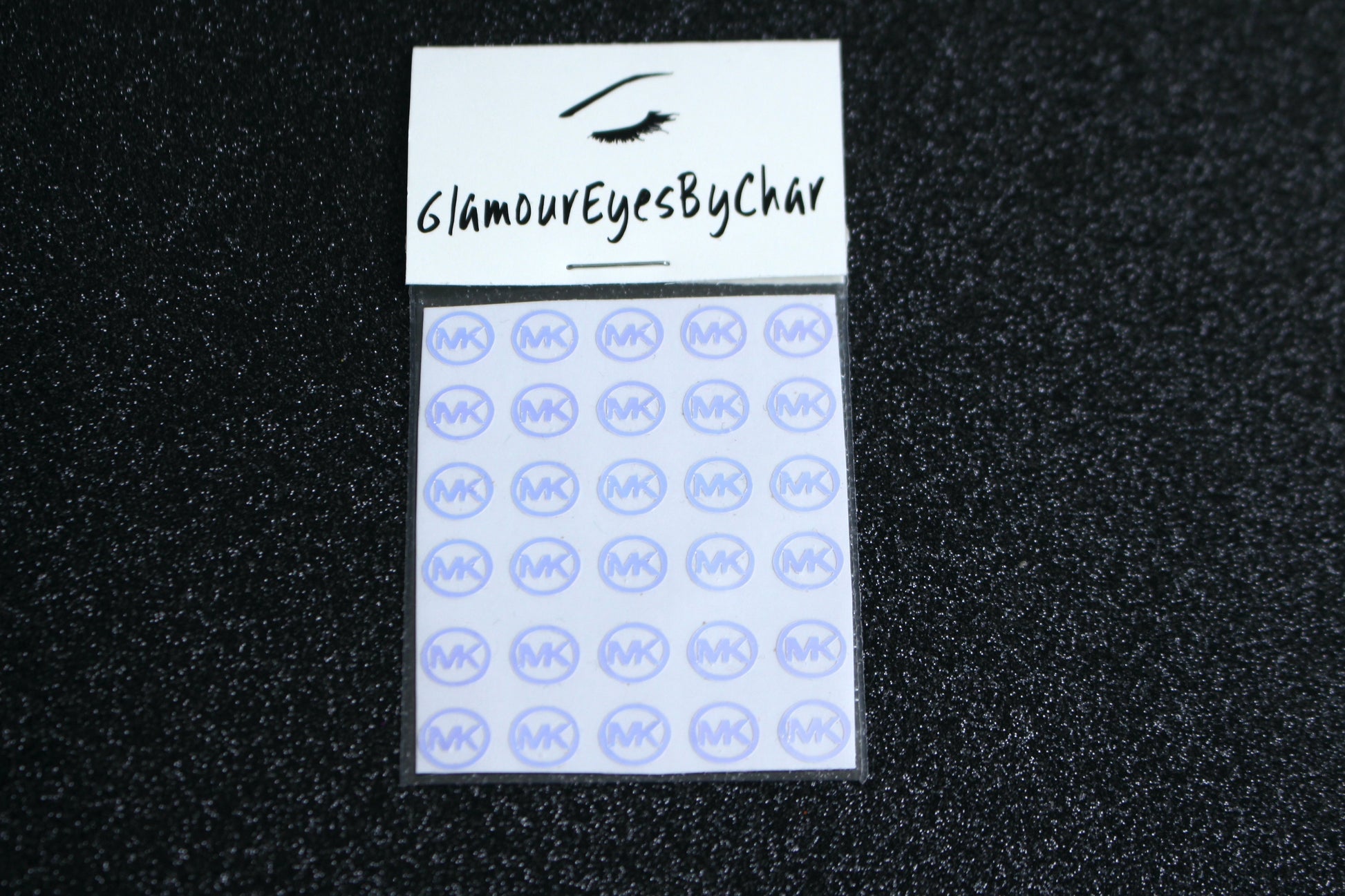 No need to go to the nail salon. Spice up your nails at home with these unique Michael Kors designer inspired nail stickers. They can be used on natural or acrylic nails. You can easily also apply them on top of regular or gel/shellac nail polish. These handmade stickers can also be used for body art or any DIY project. Each pack contains 30 stickers and is available in 5 different colours.  Tip: Apply some of our glitter on your nails to really GLAMOUREYES your look.