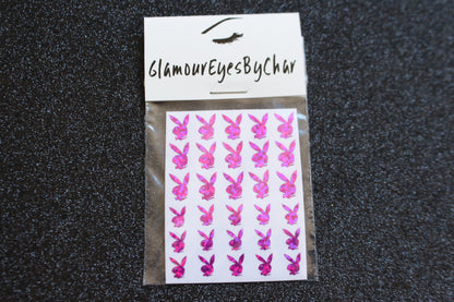 No need to go to the nail salon. Spice up your nails at home with these naughty bunny nail decals. They can be used on natural or acrylic nails. You can also apply them on top of regular or gel/shellac nail polish. These handmade decals can also be used for body art or any DIY project. Each pack contains 30 decals and is available in 6 different colours. The pack also includes 2 different sizes so that you can mix and match.  Tip: Apply some of our glitter on your nails to really GLAMOUREYES your look.