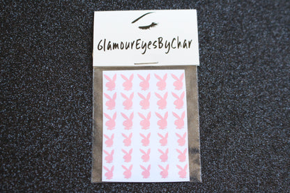 No need to go to the nail salon. Spice up your nails at home with these naughty bunny nail decals. They can be used on natural or acrylic nails. You can also apply them on top of regular or gel/shellac nail polish. These handmade decals can also be used for body art or any DIY project. Each pack contains 30 decals and is available in 6 different colours. The pack also includes 2 different sizes so that you can mix and match.  Tip: Apply some of our glitter on your nails to really GLAMOUREYES your look.