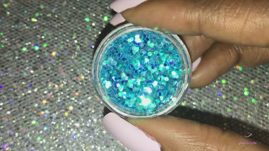 This glitter is called Sea Breeze and is part of the simple glitter collection.  It consists of aqua blue glitter with an iridescent sparkle. Flake size is larger than fine and extra fine glitter. Sea Breeze can be used for your face, body, hair and nails.  Comes in 5g jars only. **Glitter will be discontinued once sold out**