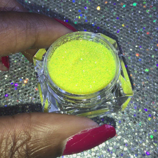 This glitter is called Caution and is part of the simple glitter collection. It consists of vibrant neon yellow iridescent glitter that reflects an orange, gold and green sparkle. Caution can be used for your face, body, hair and nails. Comes in 5g jars only.