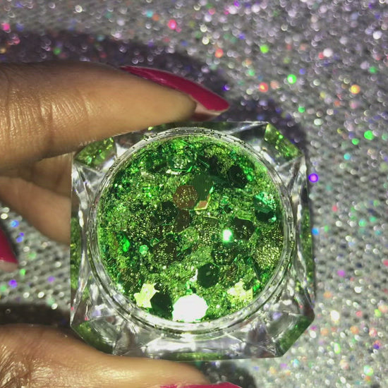 This glitter is called I'm Feeling Lucky and is part of the super chunky glitter collection.  It consists of pesto green glitter with a touch of gold. I'm Feeling Lucky can be used for your face, body, hair and nails.  Comes in 5g jars only. **Glitter will be discontinued once sold out**