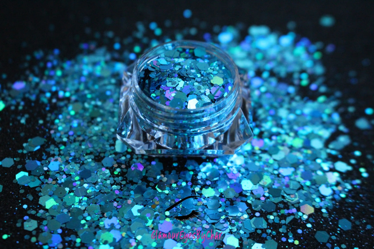 This glitter is called Aquadisiac and is part of the super chunky glitter collection.  It consists of caribbean sea blue glitter with a holographic sparkle.  Aquadisiac can be used for your face, body, hair and nails.  Comes in 5g jars only.  