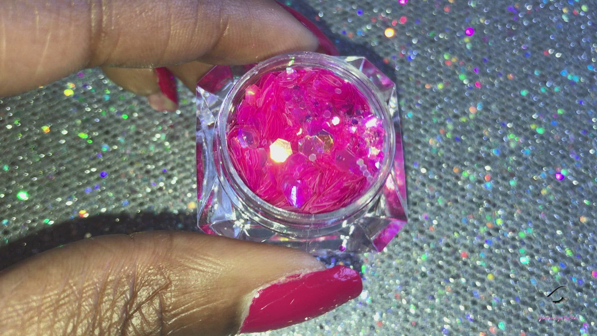 This glitter is called Candy Shop and is part of the super chunky glitter collection.  It consists of fuchsia glitter with an iridescent sparkle. Candy Shop can be used for your face, body, hair and nails.  Comes in 5g jars only.