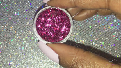 This glitter is called Pinky Swear and is part of the super chunky glitter collection. It consists of magenta glitter with a holographic sparkle.  Pinky Swear can be used for your face, body, hair and nails. Comes in 5g jars only.