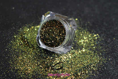 This glitter is part of the simple glitter collection. It consists of olive green glitter that reflects gold. Beautiful Nightmare can be used for your face, hair, body, nail art and glitter slime. Available in 5g jars only.  Heat resistant 