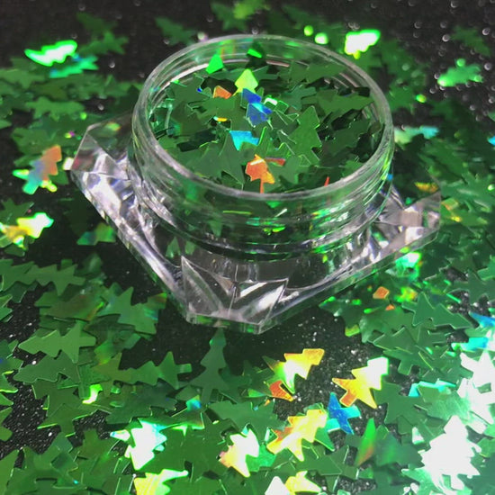 Christmas Trees – Premium 8mm Holographic Green Glitter Shapes
Part of our Holiday Collection, these festive 8mm green Christmas trees add cheerful sparkle to your nail art and glitter slime.
Available in 5g jars only.
