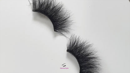 These 5D premium mink lashes are 25mm in length. They are wispy, lightweight, and comfortable to wear on the lids. The flexible cotton lash band, makes the application process a breeze.  Baddie lashes are suitable for dramatic eye looks. They will definitely make your eyes pop, but are not for timid lash wearers. You can wear this reusable style up to 25 times if handled with care. Lashes come with a cute bag, and a mascara wand so that you can take care of these beauties.