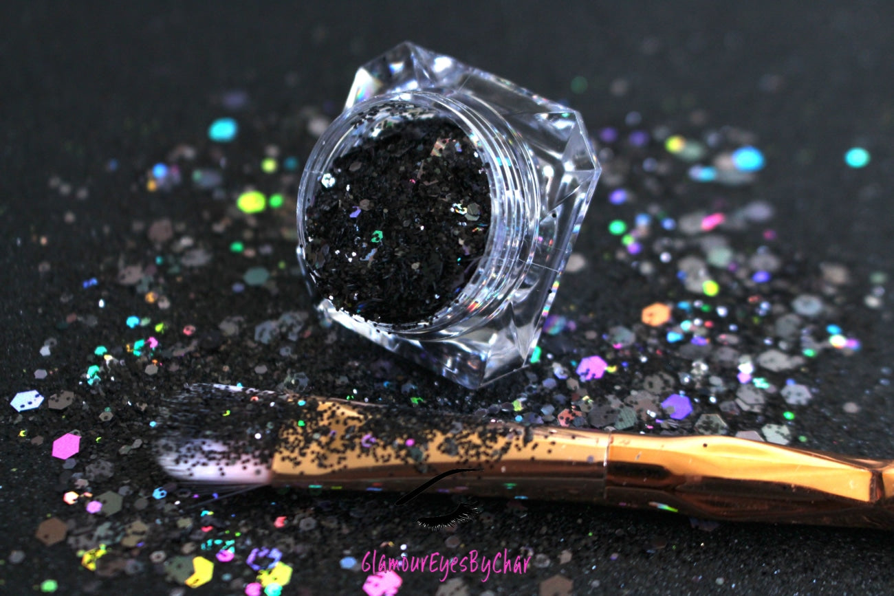 This glitter is called Black Out and is part of the super chunky glitter collection.  It consists of solid jet black glitter. If you'd like a little more sparkle, it also comes in black holographic glitter. Black Out can be used for your face, body, hair and nails.  Comes in 5g jars only.  