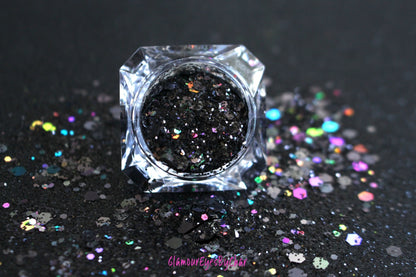 This glitter is called Black Out and is part of the super chunky glitter collection.  It consists of solid jet black glitter. If you'd like a little more sparkle, it also comes in black holographic glitter. Black Out can be used for your face, body, hair and nails.  Comes in 5g jars only.  