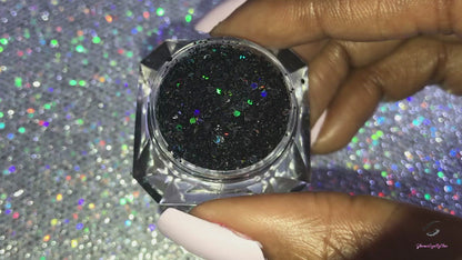 This glitter is called Midnight Madness and is part of the chunky glitter collection. It consists of black glitter with a holographic sparkle. It’s perfect to create a sexy smokey eye look. Midnight Madness can be used for your face, body, hair and nails. Comes in 5g jars only.