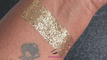 This glitter is called Champagne and is part of the simple glitter collection. It consists of dark champagne gold fine glitter. Champagne can be used for your face, body, hair and nails. Comes in 5g jars only. 