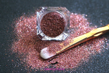  This glitter is part of the simple glitter collection. It consists of holographic rose gold glitter. Cheeky Rose can be used for your face, hair, body, nail art and glitter slime. Available in 5g jars only.  