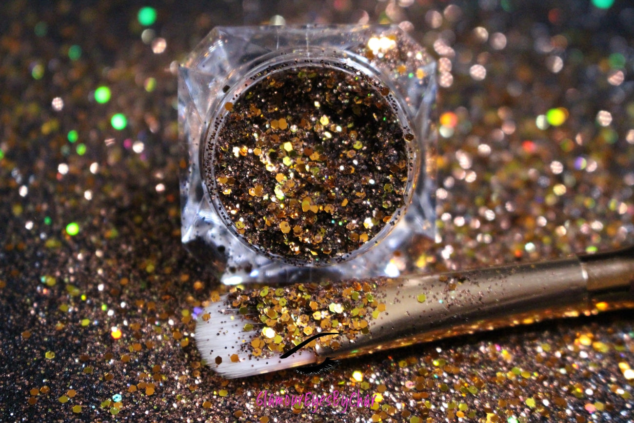 This glitter is called Cinnamon Spice and is part of the chunky glitter collection. It consists of chocolate brown and bronze metallic glitter and has gold holographic sparkle. Cinnamon Spice can be used for your face, body, hair and nails.