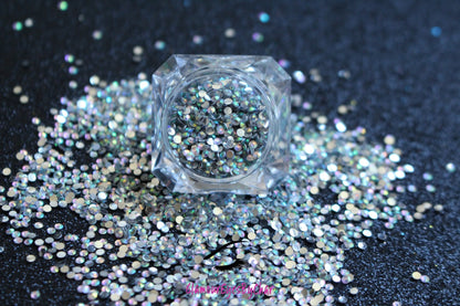 Spice up your nails or makeup look with these clear AB flatback resin rhinestones.  Stone size: 2mm and 3mm Available in 5g and 10g jars.  Note: 10g jars are round and not diamond shaped. Rhinestones are not counted individually and go by the weight of the jar.  Tip#1:  Apply rhinestones with our crystal dual-ended rhinestone picker. The application process will be made quick and easy.