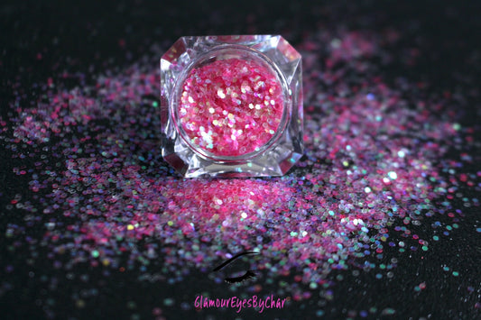 This glitter is called Cotton Candy and is part of the simple glitter collection.  It consists of pink glitter with an iridescent sparkle. Flake size is larger than fine and extra fine glitter. Cotton Candy can be used for your face, body, hair and nails.  Comes in 5g jars only.