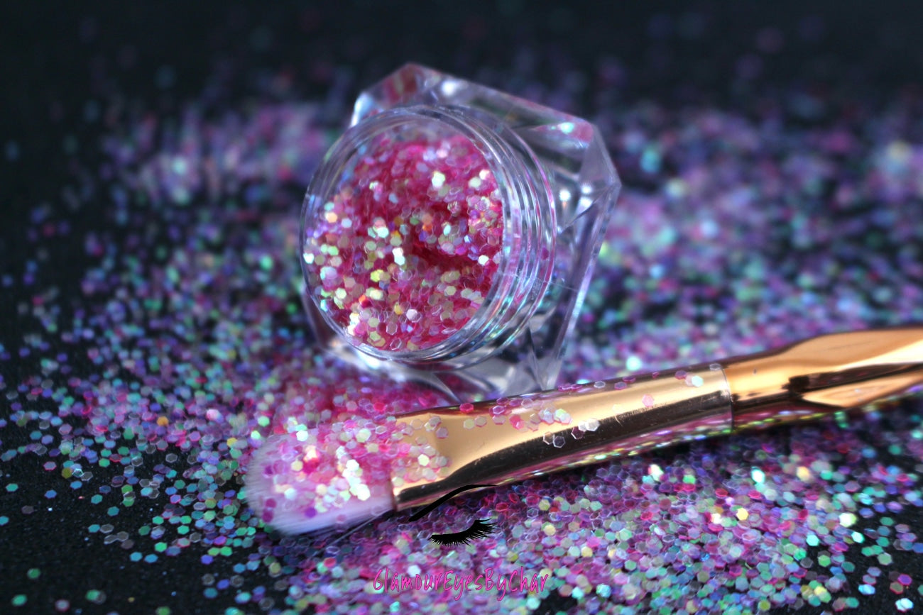 This glitter is called Cotton Candy and is part of the simple glitter collection.  It consists of pink glitter with an iridescent sparkle. Flake size is larger than fine and extra fine glitter. Cotton Candy can be used for your face, body, hair and nails.  Comes in 5g jars only.