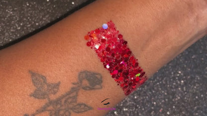 This glitter is called Santa Baby and is part of the super chunky glitter collection. It consists of ruby red glitter with a holographic sparkle. Santa Baby can be used for your face, body, hair and nails. Available in 5g jars only.