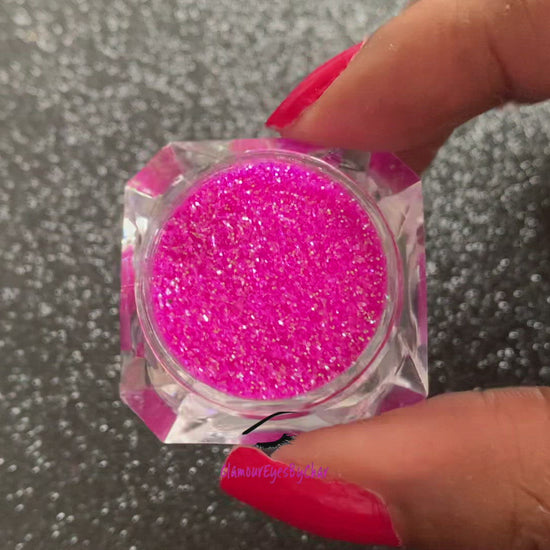 This glitter is called Bubble Yum and is part of the simple glitter collection. It consists of vibrant neon pink iridescent glitter that reflects a green sparkle. Bubble Yum can be used for your face, body, hair and nails. Comes in 5g jars only.