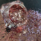 This glitter is called Blush and is part of the simple glitter collection. It consists of rose gold glitter with a beautiful sparkle. Flake size is larger than fine and extra fine glitter.  Blush can be used for your face, body, hair and nails. Comes in 5g jars only.