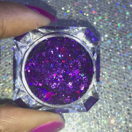 This glitter is called Love Spell and is part of the super chunky glitter collection. It consists of deep purple and violet glitter with a holographic sparkle. Love Spell can be used for your face, body, hair and nails. Comes in 5g jars only.