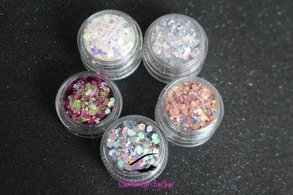 The Dreamland stacker is comprised of dazzling glitters from the super chunky collection. These glitters are perfect for an eye catching look for a night out on the town. The glitters in this set are as follows: Galaxy Illusion She's Perfect Looking Glass Masquerade  The Dreamland stacker can be used for your face, body, hair and nails. Available in 5g jars only. 