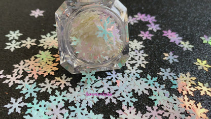 Snowflakes – Premium 9mm Iridescent Glitter Shapes
Part of our Holiday Collection, these delicate 9mm snowflakes shimmer in two enchanting iridescent colours. Perfect for adding a touch of cozy winter magic to your nail art and glitter slime.
Available in 5g jars only.