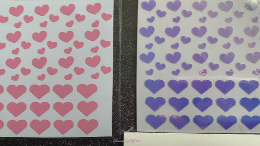 No need to go to the nail salon. Spice up your nails at home with these cute heart nail decals. They can be used on natural or acrylic nails. You can also apply them on top of regular or gel/shellac nail polish. These handmade decals can also be used for body art or any DIY project. Each pack contains 60 decals and is available in 4 different colours. The pack also includes 4 different sizes so that you can mix and match.  Tip: Apply some of our glitter on your nails to really GLAMOUREYES