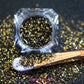 This glitter is called Elegance and is part of the chunky glitter collection. It consists of black and gold glitter with a holographic sparkle. Elegance can be used for your face, body, hair and nails. Comes in 5g jars only.   