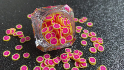 These Grapefruit Fruit Slices are PERFECT for 3D nail or body art. They can also be used for a DIY craft project. The fruit slices are made of polymer clay and are approximately 3mm/0.12 inch in size. Comes in 5g jars only. Note: Grapefruit Fruit Slices are not recommended for use in the immediate eye area. Tip: Apply some of our glitter to your nails to really GLAMOUREYES your look. 