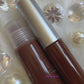 Jakki is a gorgeous chocolate brown hydrating gloss. This gloss is also vegan, gluten-free, high shine, smooth and long lasting. It's made with premium rich ingredients to keep your lips soft, moisturized and luscious without feeling sticky. Jakki is available in a squeeze tube and a wand tube (doe foot applicator) for a more precise application.