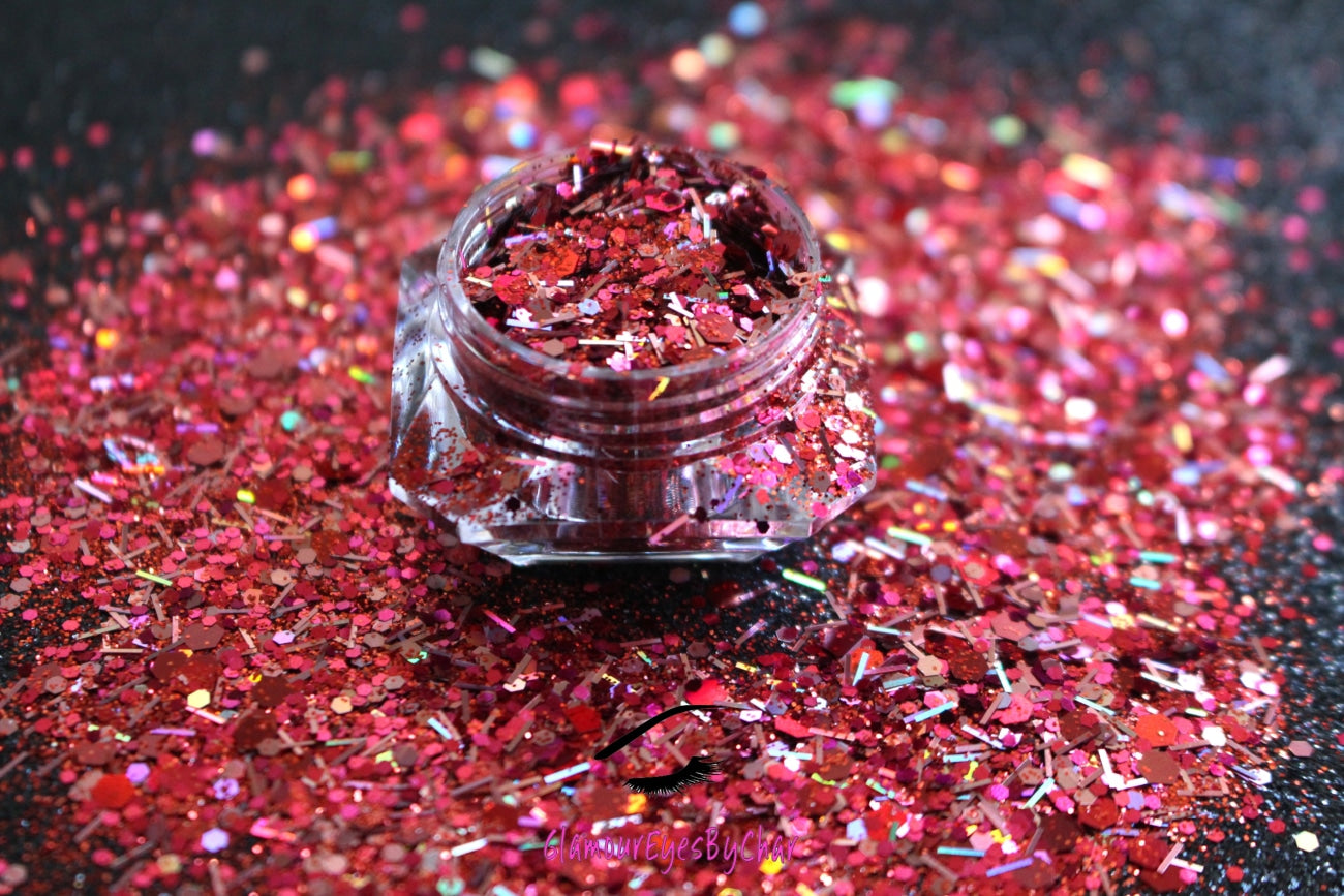 This glitter is called Fireworks and is part of the super chunky glitter collection.  It consists of garnet red and silver glitter with a dazzling holographic sparkle. Fireworks can be used for your face, body, hair and nails.  Comes in 5g jars only. **Glitter will be discontinued once sold out**