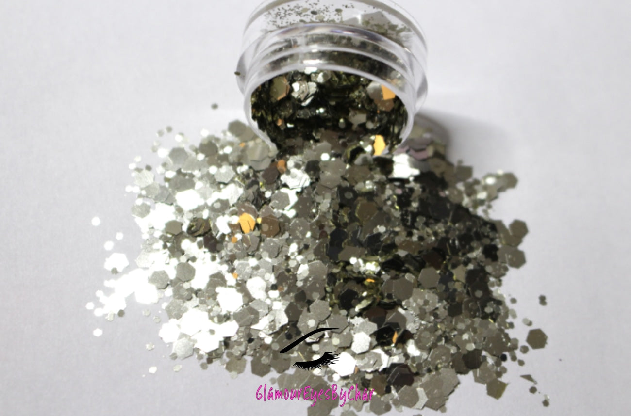 This glitter is called Fool's Gold and is part of the super chunky glitter collection.  It consists of pale gold glitter with a beautiful sparkle. It's perfect for a night out. Fool's Gold can be used for your face, body, hair and nails.  Comes in 5g jars only.