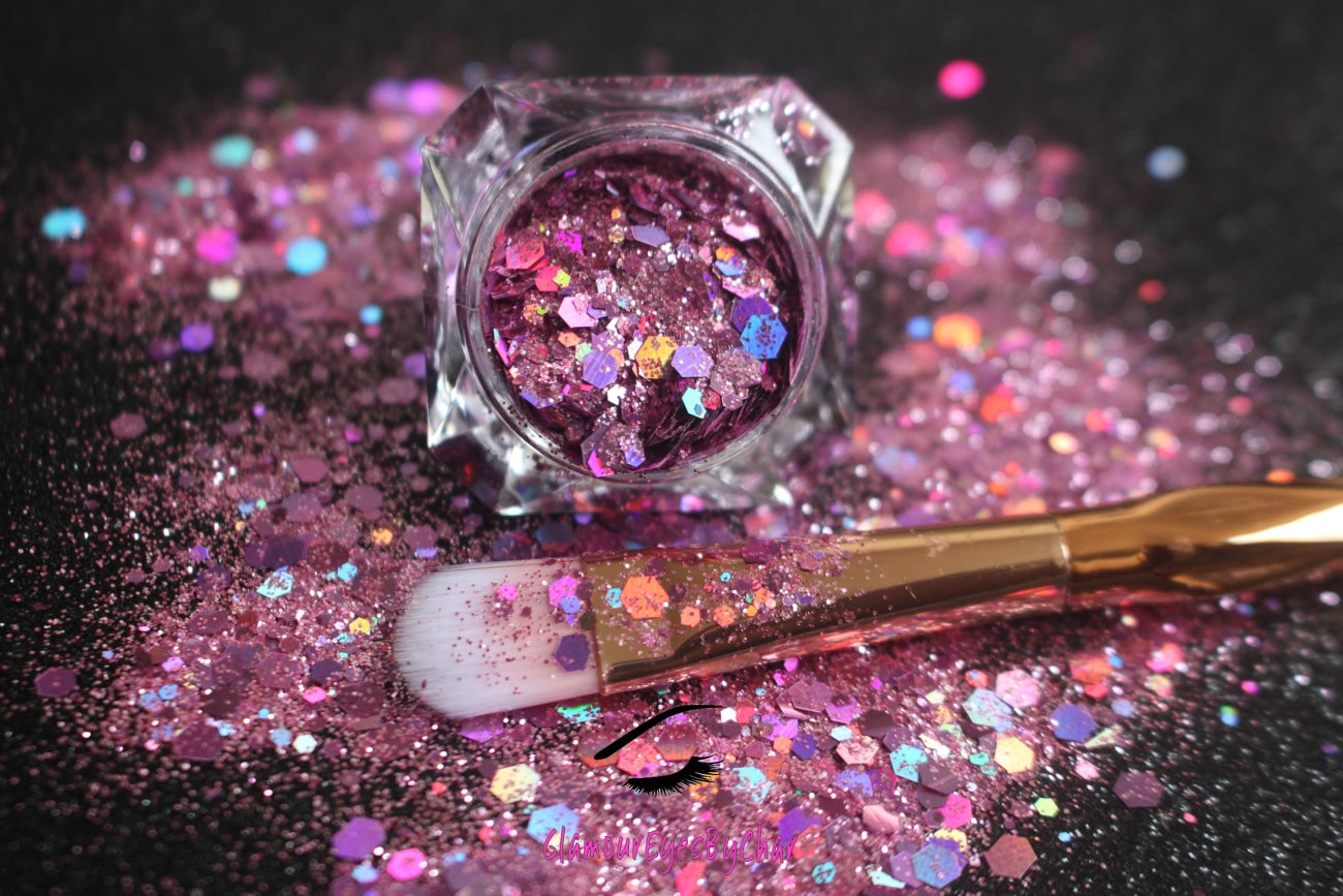 This glitter is called Girl Power and is part of the super chunky glitter collection. It consists of pink and light purple glitter with a holographic sparkle. Girl Power can be used for your face, body, hair and nails. Comes in 5g jars only.