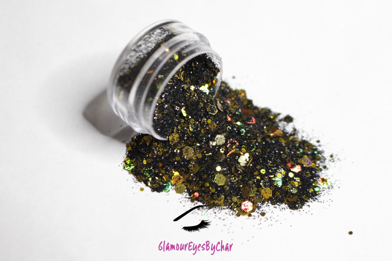 This glitter is called Gold Mine and is part of the super chunky glitter collection.  It consists of black and gold glitter with a holographic dazzling sparkle. Gold Mine can be used for your face, body, hair and nails.  Comes in 5g jars only.