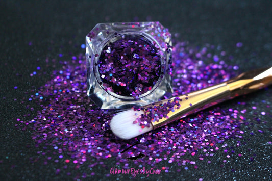 This glitter is called Grapesicle and is part of the simple glitter collection. It consists of dark violet glitter with a holographic sparkle.  Flake size is larger than fine and extra fine glitter.  Grapesicle can be used for your face, body, hair and nails. Comes in 5g jars only.