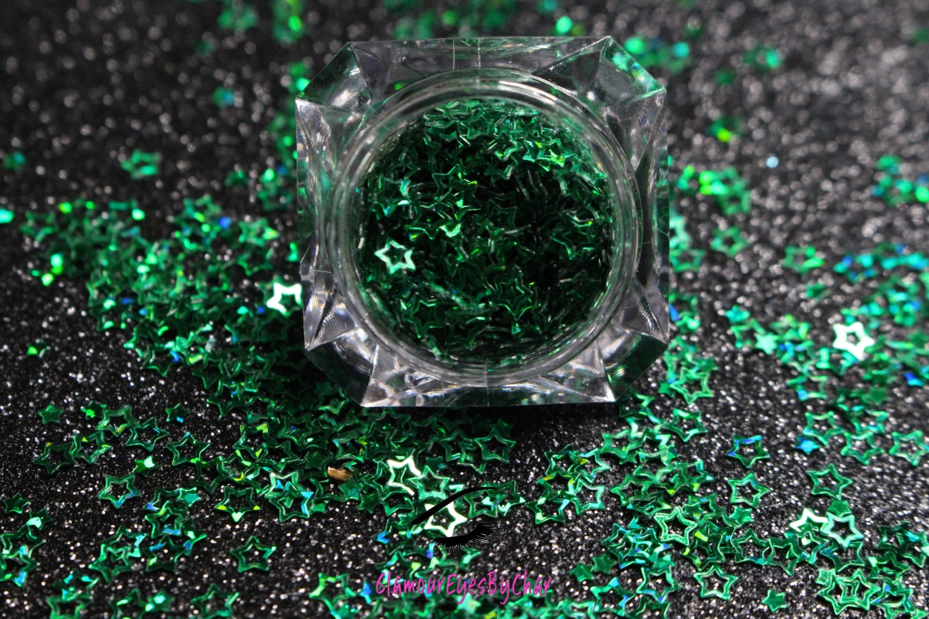 This glitter is called Green Stars and is part of the shaped glitters collection. It consists of emerald green small and large stars. Green Stars is perfect for nail and body art.