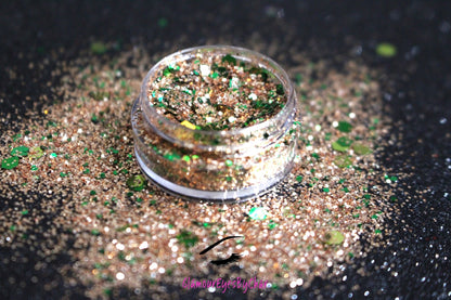 This glitter is called Halo and is part of the holiday collection.  It consists of emerald green and gold glitter. Halo can be used for your face, body, hair and nails.  Comes in 5g jars only.  