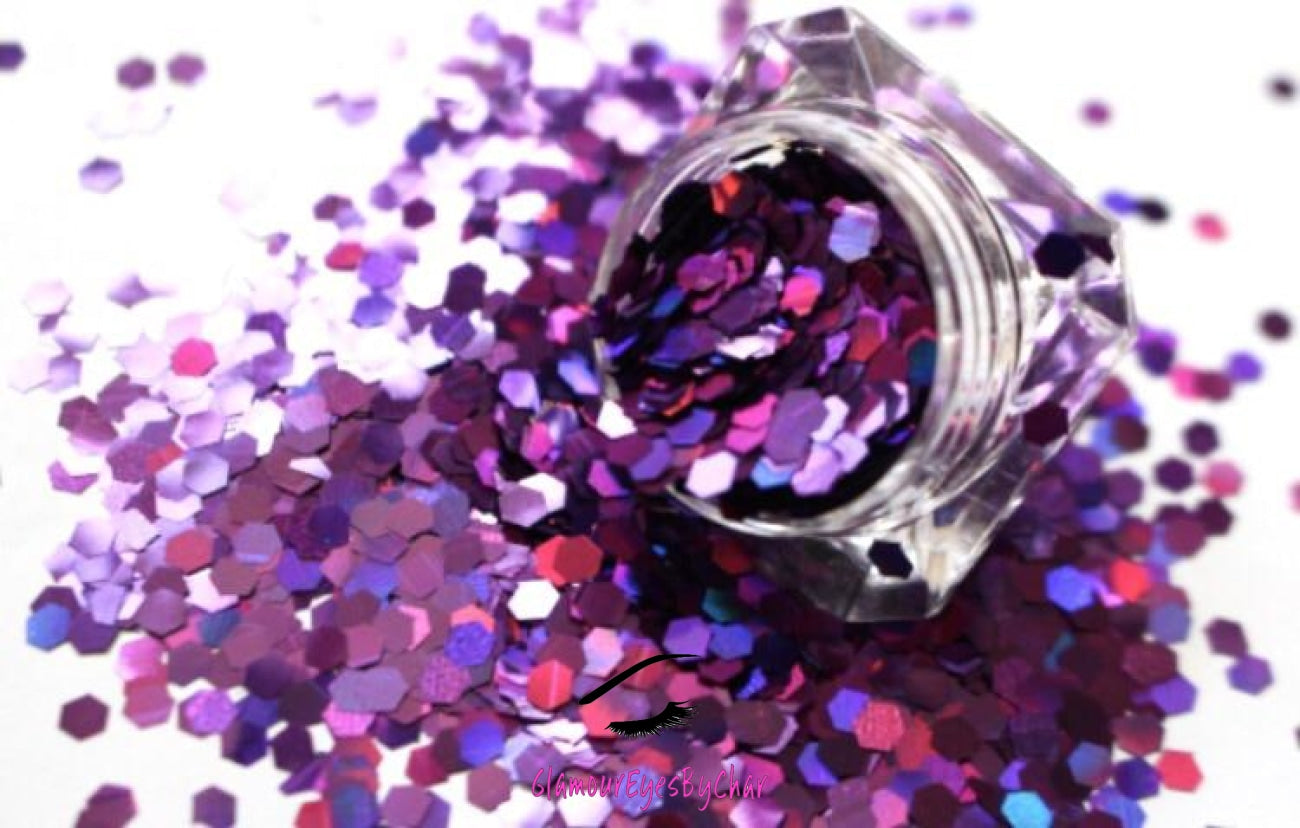 This glitter is called Her Majesty and is part of the simple glitter collection. It consists of dark violet glitter with a holographic sparkle. Flake size is 3mm hex. Her Majesty can be used for your face, body, hair and nails. Comes in 5g jars only. **Glitter will be discontinued once sold out**