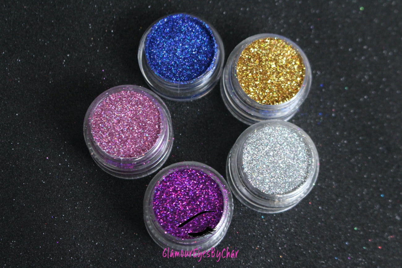 The Holo There stacker is comprised of dazzling holographic glitters from the simple glitter collection. These glitters will give you the perfect pop to your look and are suitable for beginners. The glitters in this set are as follows: Va Va Violet Lovesick Princess Cut I Said Yes Denim Day  The Holo There stacker can be used for your face, body, hair and nails. Available in 5g jars only. 
