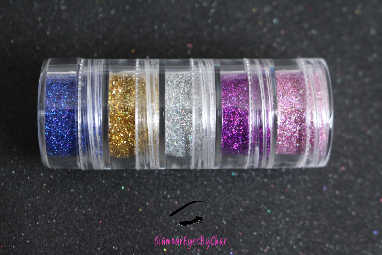 The Holo There stacker is comprised of dazzling holographic glitters from the simple glitter collection. These glitters will give you the perfect pop to your look and are suitable for beginners. The glitters in this set are as follows: Va Va Violet Lovesick Princess Cut I Said Yes Denim Day  The Holo There stacker can be used for your face, body, hair and nails. Available in 5g jars only. 