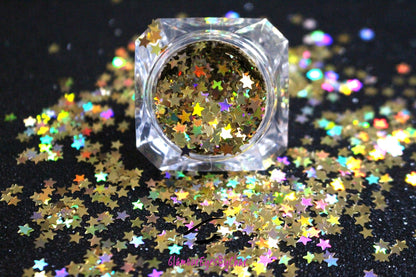 This glitter is called Holographic Gold Stars and is part of the shaped glitters collection.  It consists of gold small stars with a holographic sparkle. Holographic Gold Stars is perfect for body and nail art or DIY projects.  Comes in 5g jars only.