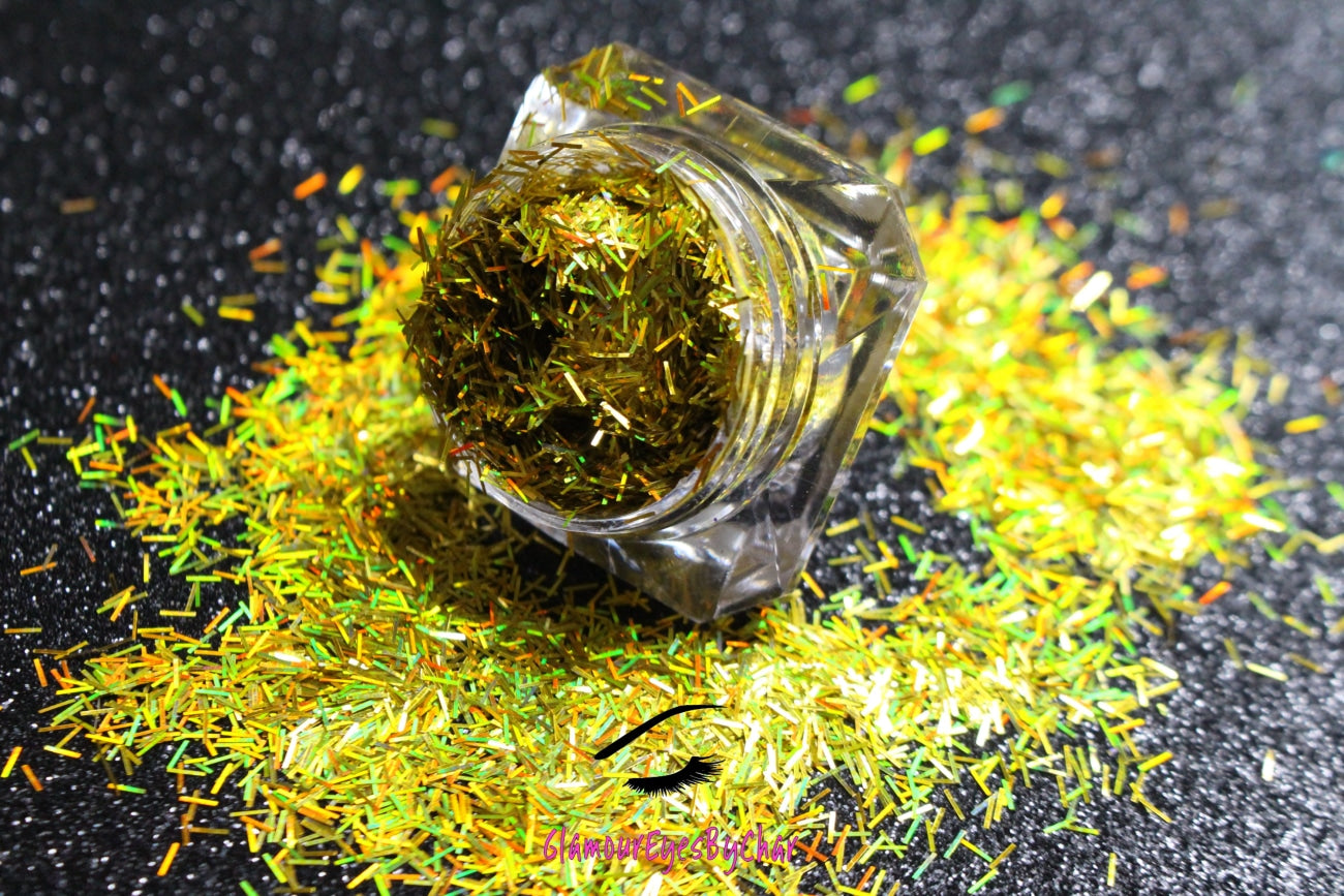 This glitter is called Holographic Gold Strips and is part of the shaped glitters collection. It consists of yellow gold strips with a holographic sparkle. Holographic Gold Strips can be used for your face, body, hair and nails. 